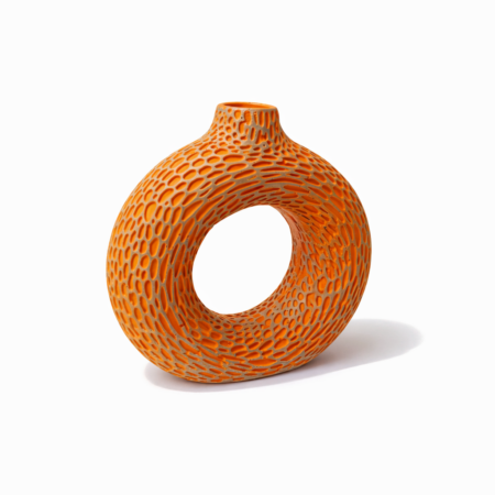 design in orange vase