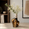 Handmade sculptural vase in bronze black and gold finish with organic openings by DecoCorn